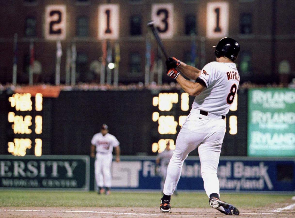 File photo of Baltimore Orioles Cal Ripken Jr. hittng a base hit in the eighth inning of his 2, 131st consecutive game in Baltimore